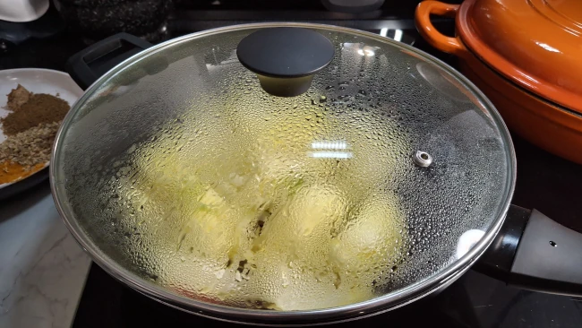 sweating-onions-in-pan-with-lid-on