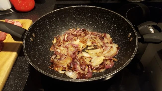 onions browning for lamb curry with spinach onions browning