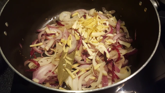 ginger and bayleaf added to onions for lamb kofta curry ginger, bayleaf added to onions