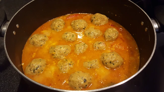 meatballs added to sauce for lamb kofta curry meatballs added to sauce