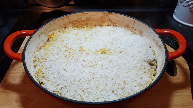 cooked lamb pualao rice in pan