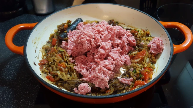 meat added to onions and spices