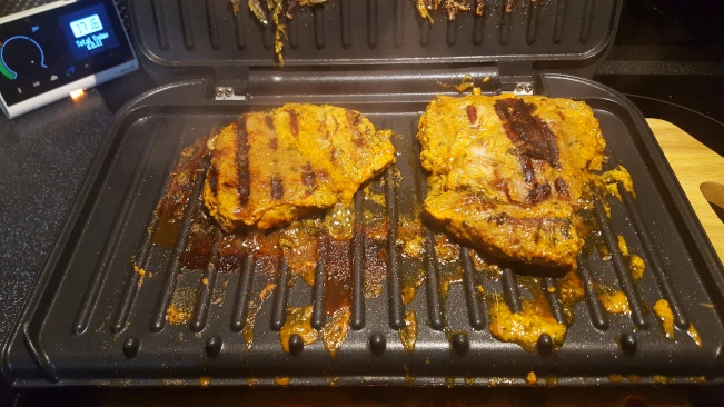 cooked lamb tikka steaks on grill cooked lamb steaks on grill