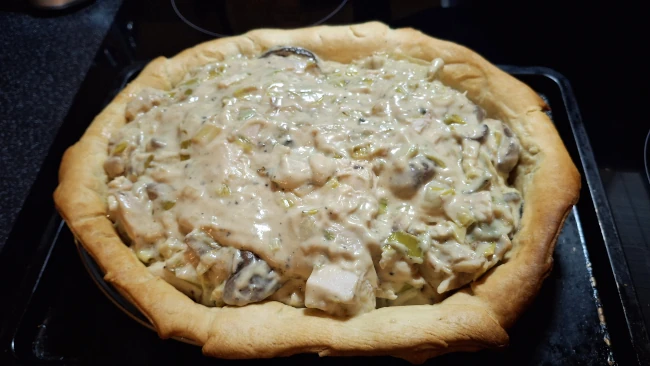 creamy pie filling in pastry base bake for luxury chicken pie with mushrooms & leeks creamy pie filling in pastry base