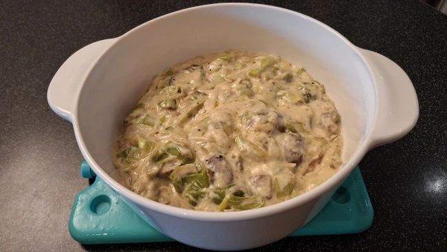 mushrooms, leeks & roux cooling in a dish for luxury chicken pie with mushrooms & leeks mushrooms, leeks roux cooling in a dish