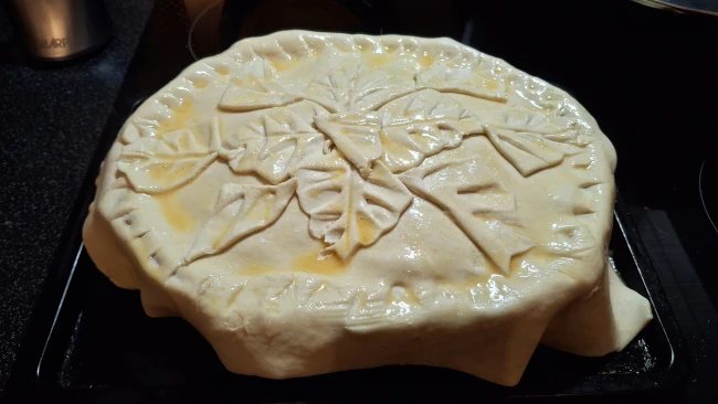 pastry decor added to pie top of luxury chicken pie with mushrooms & leeks pastry decor added to pie top
