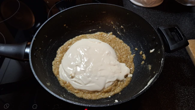 roux and cream in a pan for luxury chicken pie with mushrooms & leeks roux and cream in a pan