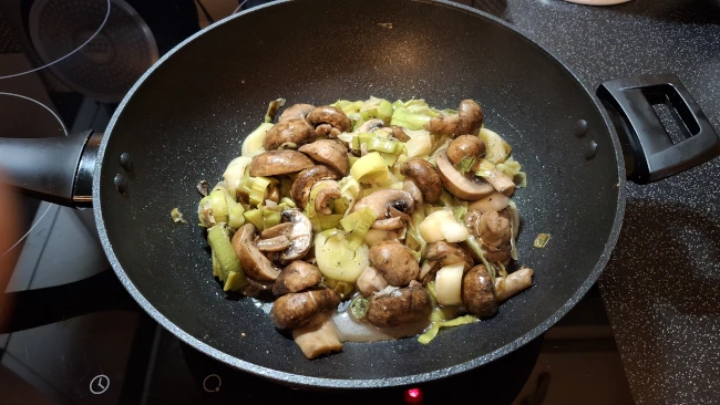 softened leeks & mushrooms in a pan for luxury chicken pie with mushrooms & leeks softened leeks & mushrooms in a pan