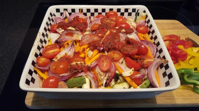 olive oil & seasoning added to veg' for Mediterranean style vegetables with pork steaks ground pepper added to veg 03