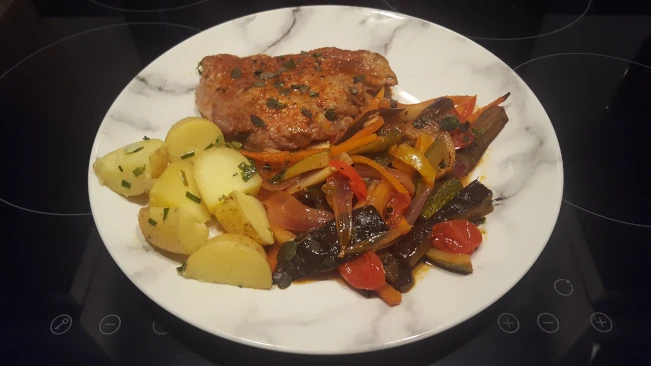 Mediterranean style vegetables with pork steaks Mediterranean style vegetables with pork steaks plated 03