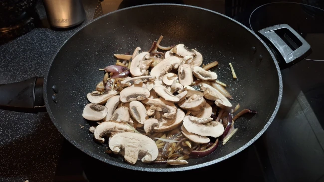 mushrooms added to wok for mushroom chow mein mushrooms added to wok