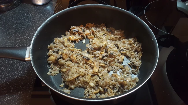 rice and mushrooms stir fried in a pan for mushroom fried rice rice and mushrooms stir fried