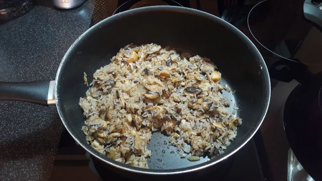 rice and mushrooms stir fried in a pan for mushroom fried rice rice and mushrooms stir fried