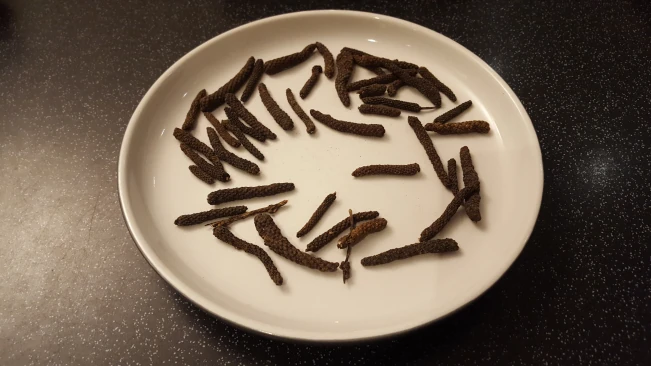 indian long peppers on a plate for Nutty's braised steak indian long peppers on a plate