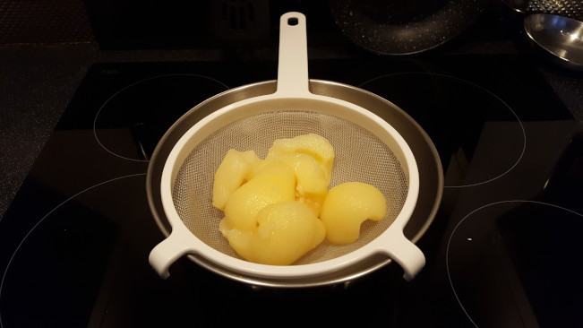 pear halves in sieve