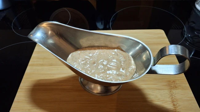 perinaise sauce in a sauce boat for peri peri pork steaks perinaise sauce