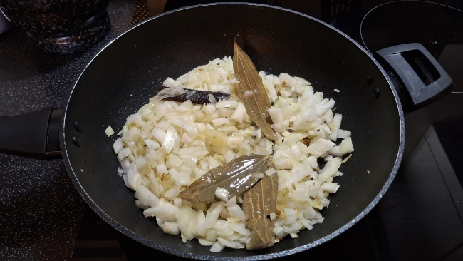 onions added to frying spices for pomegranate chicken curry onions added to frying spices