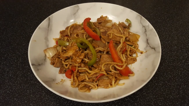 pork and blackbean sauce with noodles plated