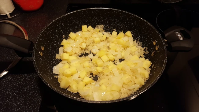 potatoes rice and onions in wok