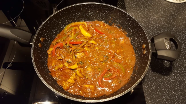 pork madras curry cooked in a wok pork madras curry finished