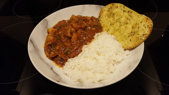 pork vindaloo basmati rice and naan plated