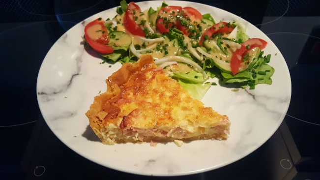 the Ultimate Quiche lorraine with salad on a plate quiche lorraine cooked