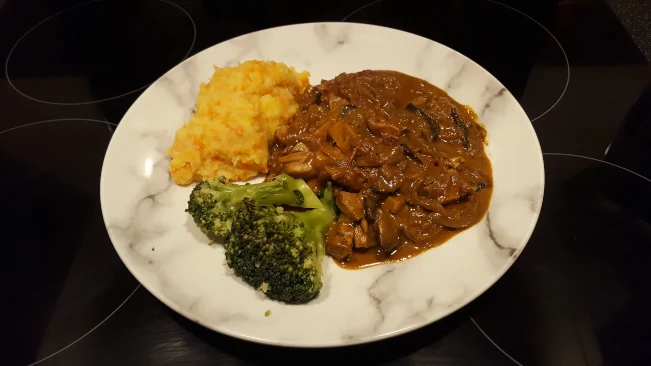 roast pork stroganoff plated with sweet root mash & brocolli pork stroganoff plated 3
