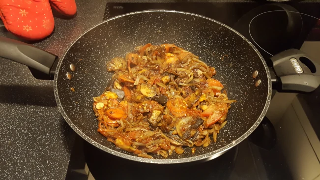 tomatoes cooked with onions & mushrooms in a wok tomatoes cooked