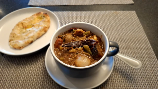 sambar - south Indian lentils & vegetables with naan on the side sambar with naan on the side