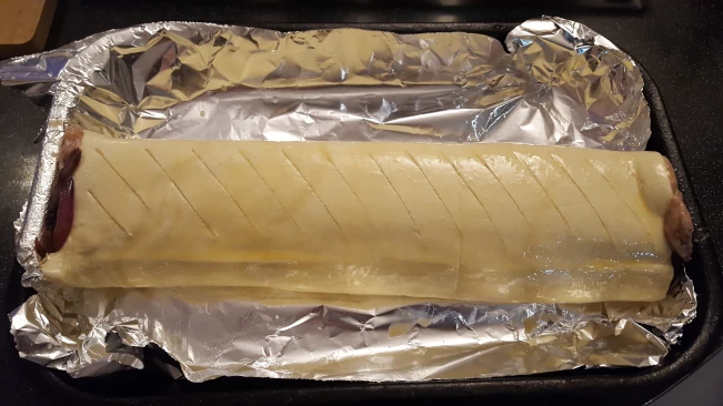raw sausage roll egg washed
