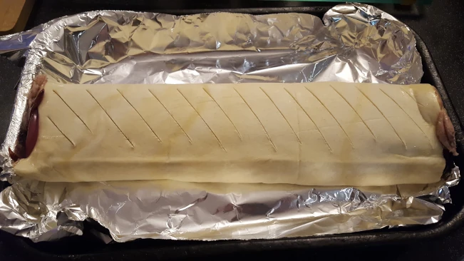raw sausage roll scored