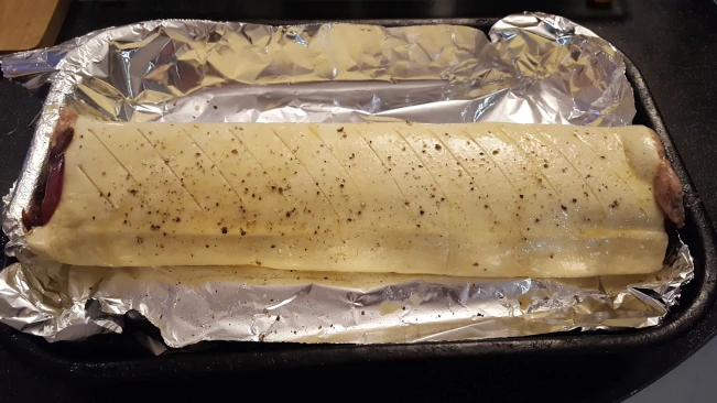 raw sausage roll seasoned