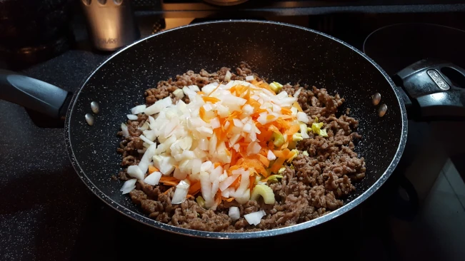 main ingredients for savoury mince and mash carrots onion celery added to browned mince