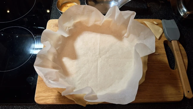 quiche base lined with paper