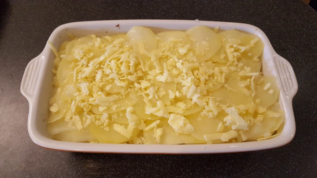 grated cheese added to potatoes for smoked haddock bacon bake grated cheese topping