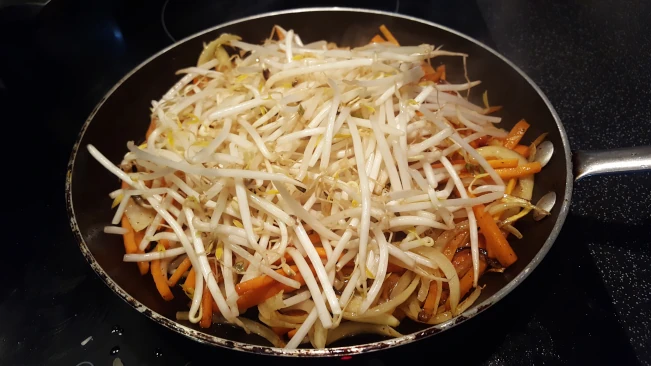 onions and carrots frying