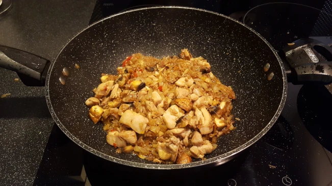 mushrooms combined with ingredients in wok