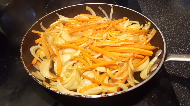 onions and carrots frying