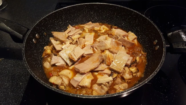 sliced pork added to pan