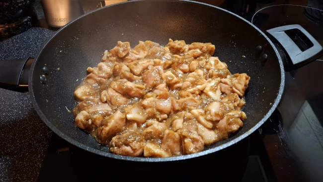 chicken frying in wok