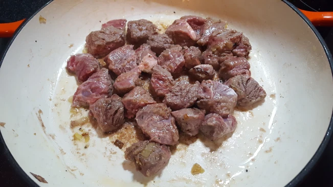 sealing steak in a pan