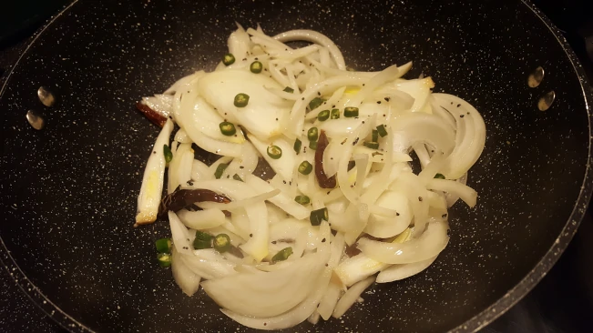 green chillies added to onions green chillies added