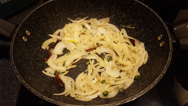onions softened for tarka dhal onions and chillies softened