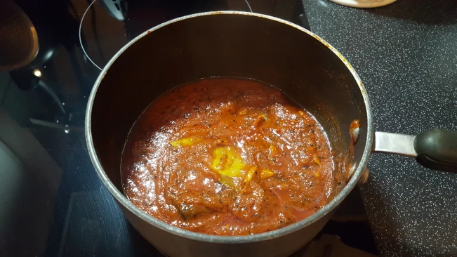 fried-spices-and-tomato-juice-for-tomato-chutney fried-spices-added-to-reduced-tomato-juice
