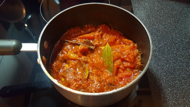 ttomato chutney cooking in a pan tomato chutney cooking in pan