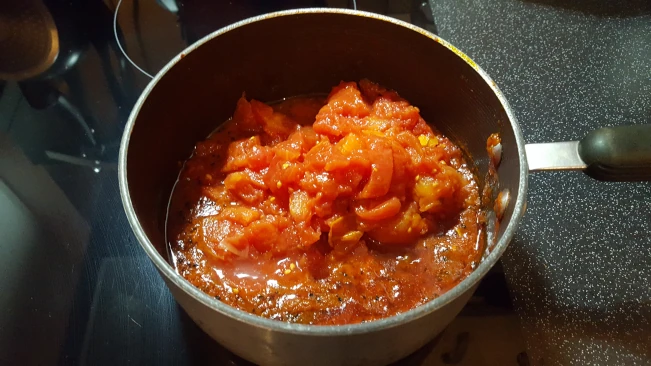 tomatoes-added-to-spiced-juice-for-tomato-chutney tomatoes-added-to-spiceed-juice-in-a-pan